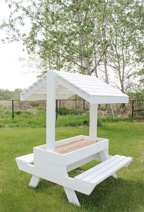 covered picnic table with sandbox