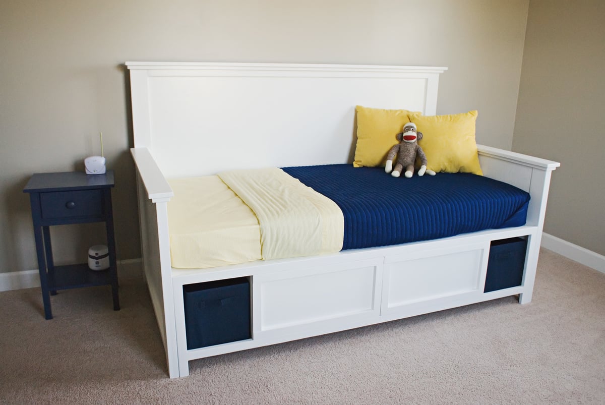 white daybed with storage compartments