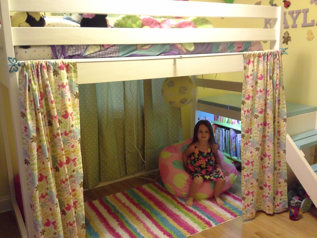 Camp Loft Bed with Added Book Shelf and Curtain.