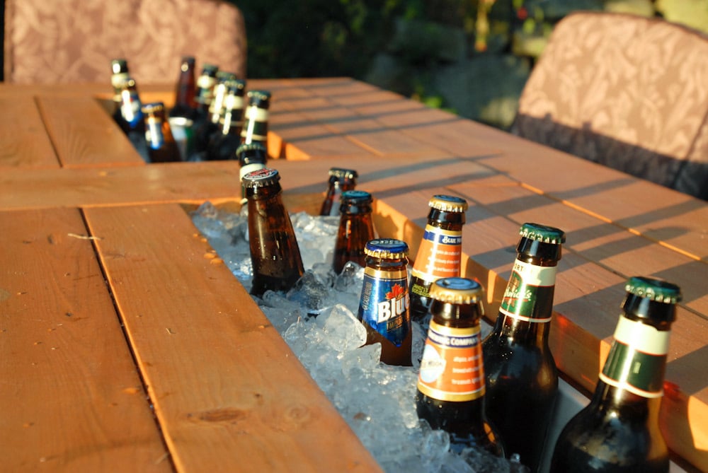 Patio Table with Built-in Beer/Wine Coolers with beer