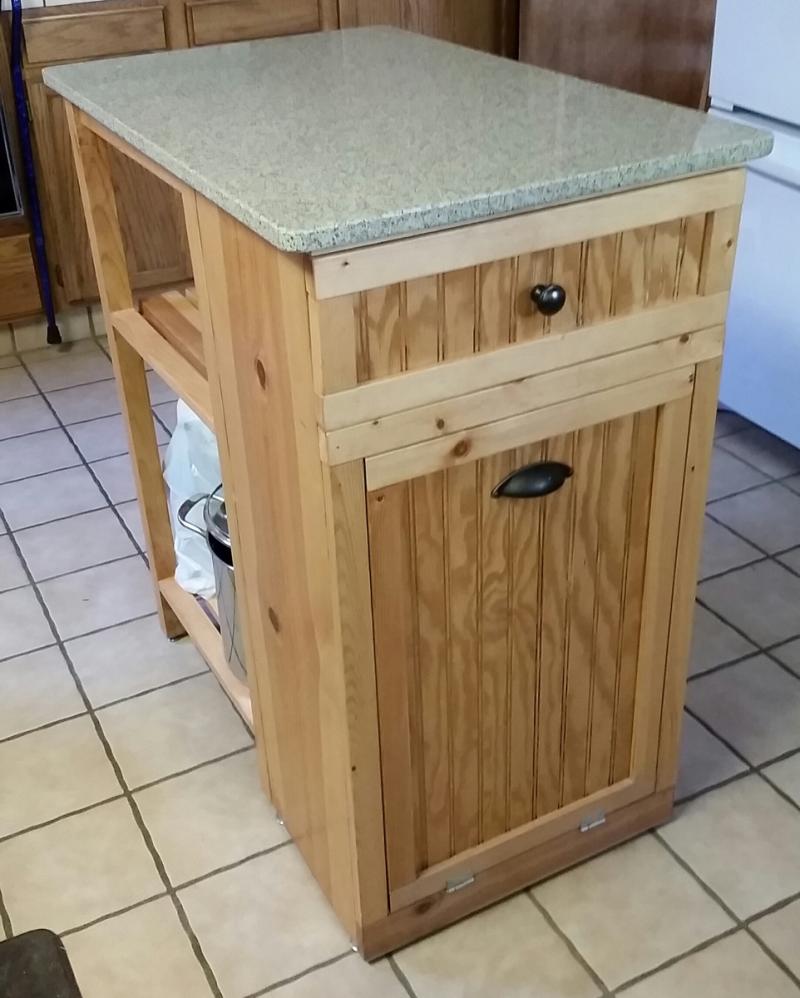 small kitchen island with tilt out trash