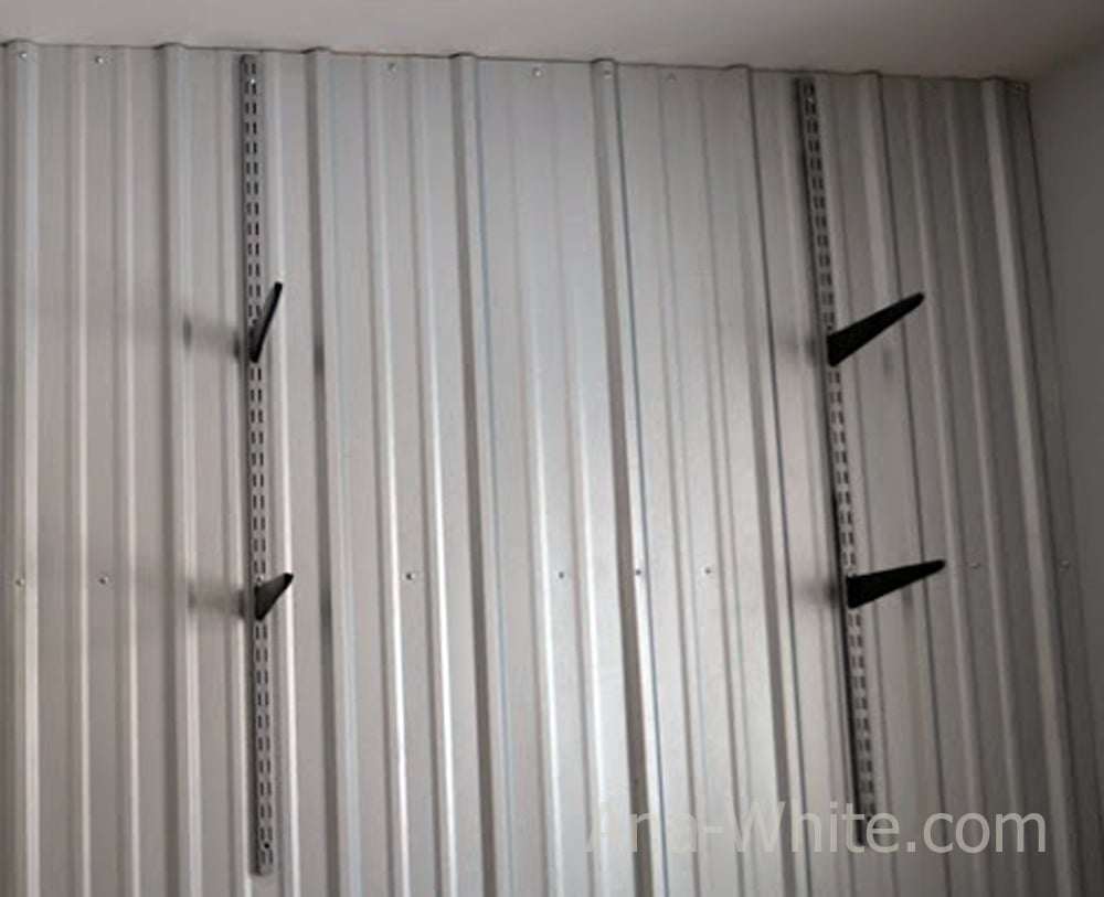clip shelf support brackets into vertical shelving tracks