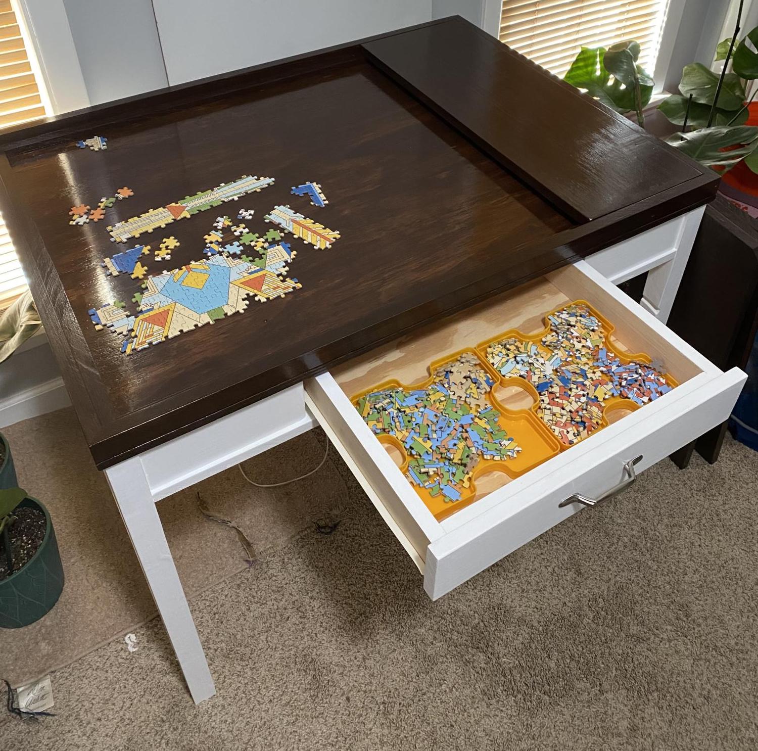 A mechanical table with a hidden puzzle surface 