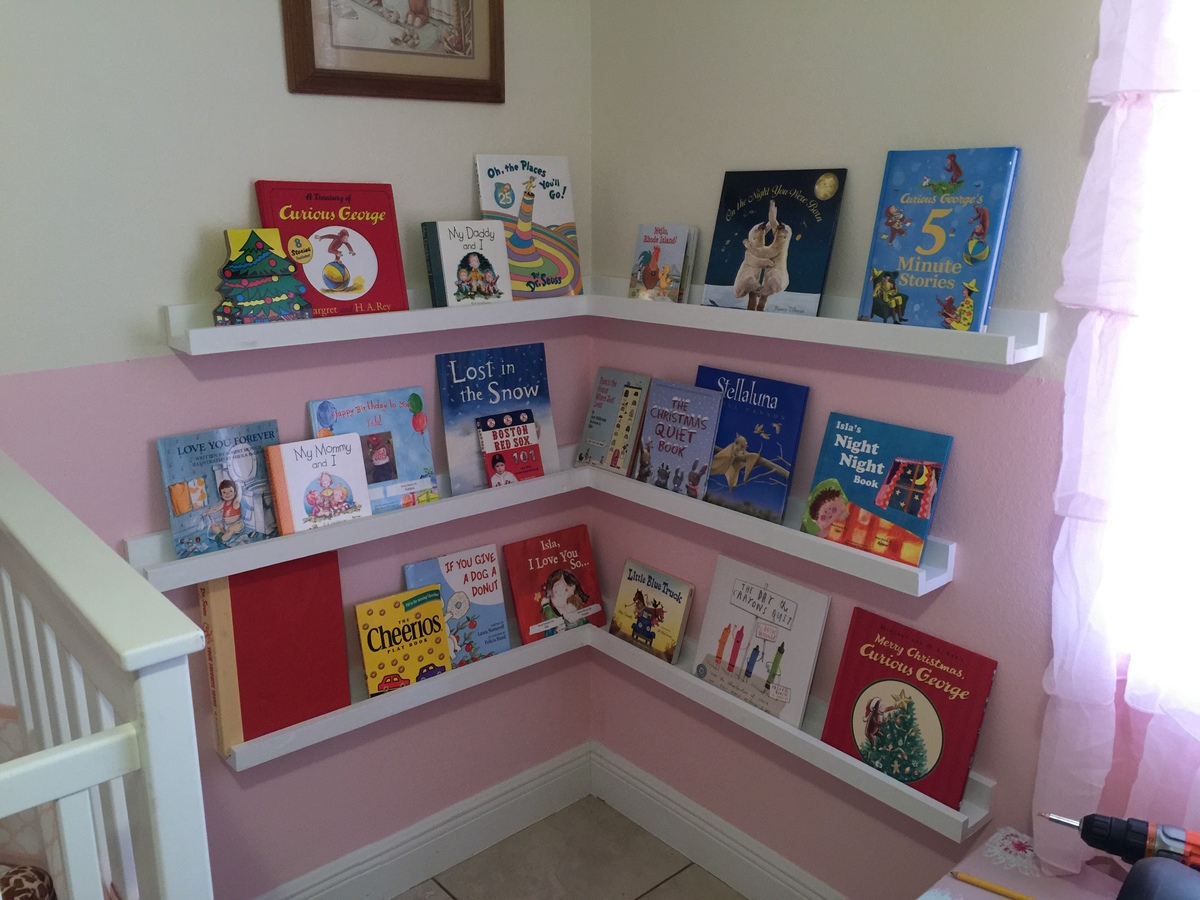 white corner bookshelf for nursery