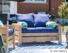 Modern outdoor loveseat with blue cushions