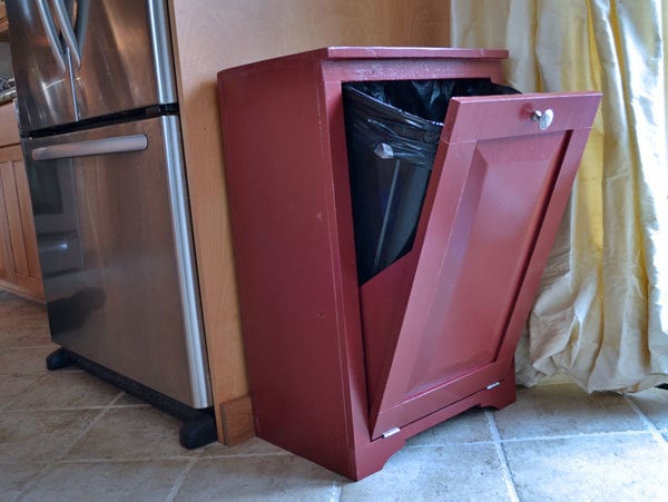 wood trash bin cabinet painted red with door open